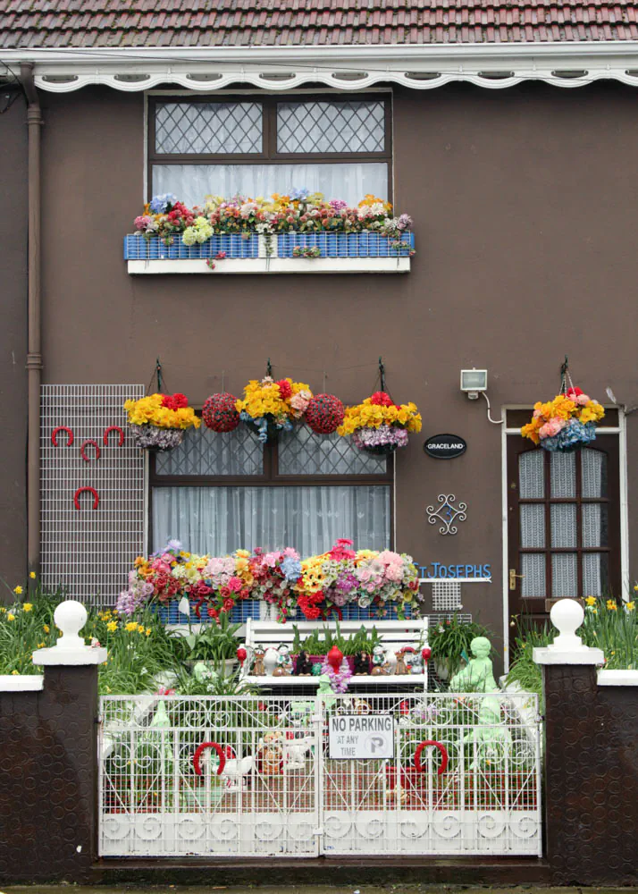 Heavily decorated front garden at a terraced house in Bray, Co. Wicklow, Ireland