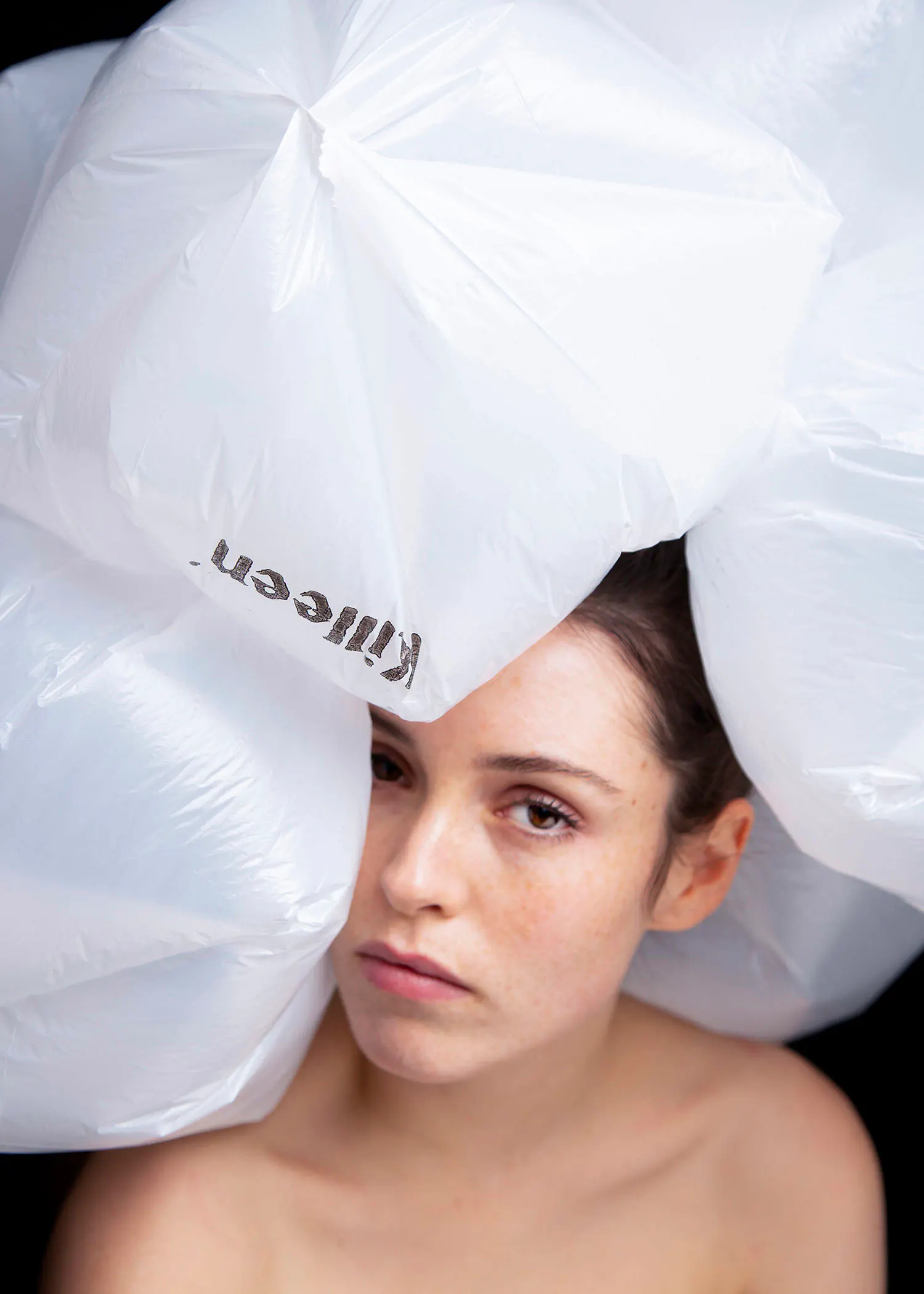 Single-use plastic bag awareness portrait of young woman
